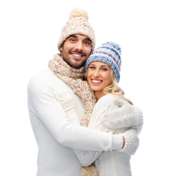 smiling couple in winter clothes hugging - Foto, Imagem