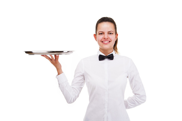 Mujer joven en bandeja de sujeción uniforme camarero aislado sobre blanco b
 - Foto, Imagen