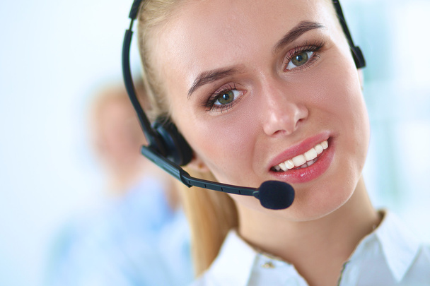 Attractive positive young businesspeople and colleagues in a call center office - Photo, Image