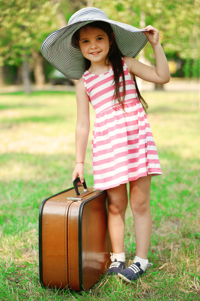 Happy little girl in striped dress - Fotoğraf, Görsel