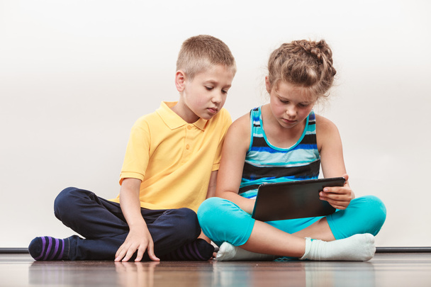 Children playing on tablet. - Foto, Imagem