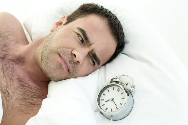man in bed with alarm clock - Photo, Image