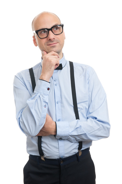 thinking bald man with suspenders and bow-tie looking up - Φωτογραφία, εικόνα
