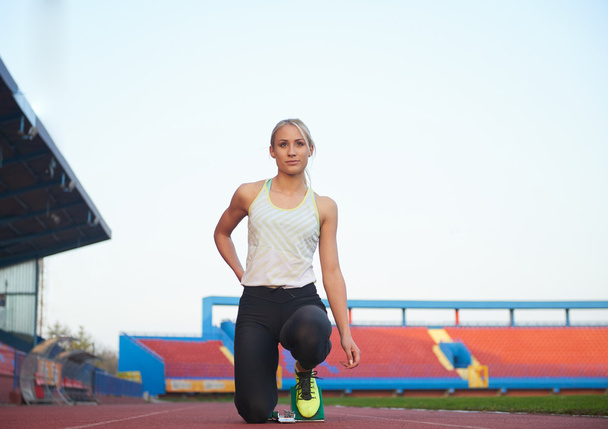 pixelated design of woman  sprinter leaving starting blocks - Fotografie, Obrázek