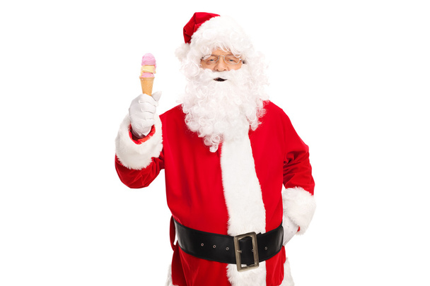 Santa Claus holding an ice cream cone  - Fotografie, Obrázek