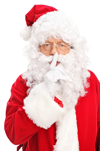 Santa Claus holding a finger on his lips  - Fotografie, Obrázek