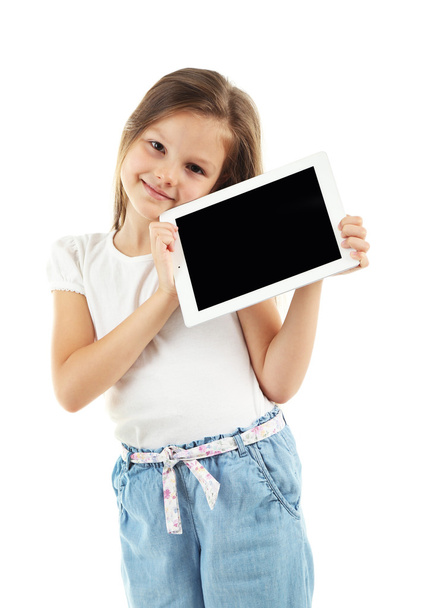 Beautiful little girl with digital tablet - Valokuva, kuva