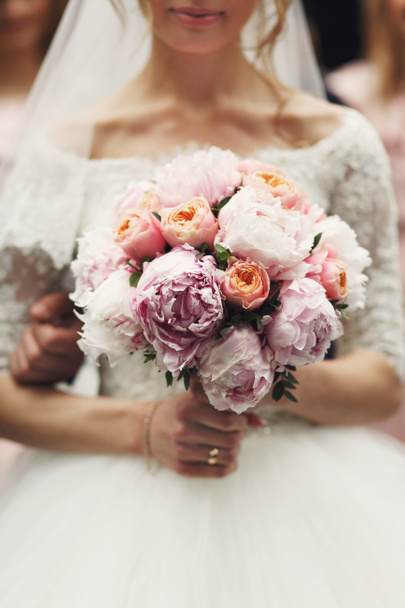 bride with rose wedding bouquet - Photo, image