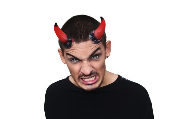 Young evil man with horns on his head - Fotó, kép