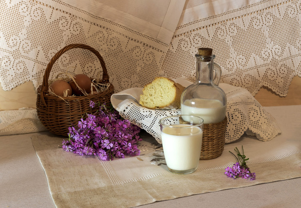The rural still-life with milk and bread - Photo, Image