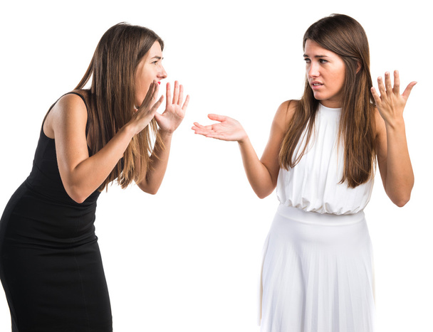 Woman shouting at her sister - 写真・画像