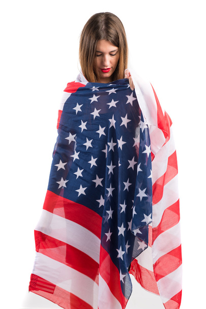 Girl holding an american flag - Фото, изображение