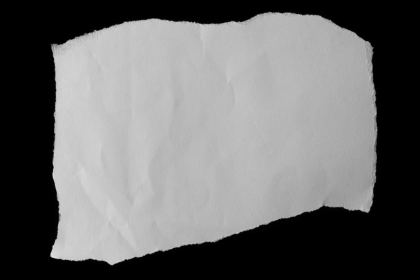 Torn paper on black - Zdjęcie, obraz