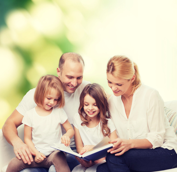 happy family with book at home - Foto, immagini