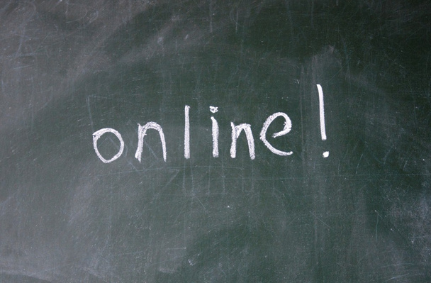 Online sign written with chalk on blackboard - Photo, Image