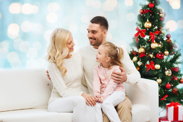 happy family at home with christmas tree - Фото, изображение