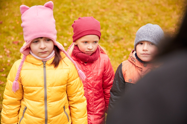 sad kids being blamed for misbehavior outdoors - Zdjęcie, obraz
