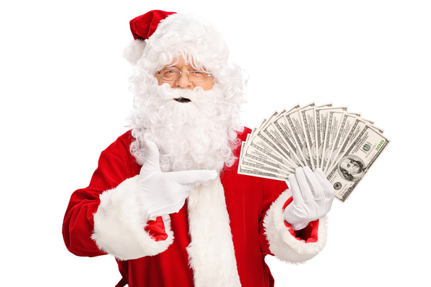 Santa Claus holding money  - Fotografie, Obrázek