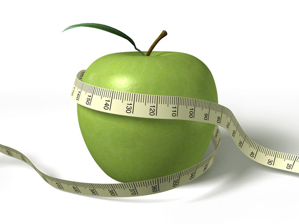 Ruban à mesurer enroulé autour de la pomme verte
 - Photo, image