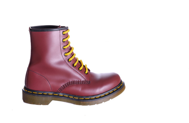 Classic cherry red oxblood lace-up boot with yellow laces - Photo, Image
