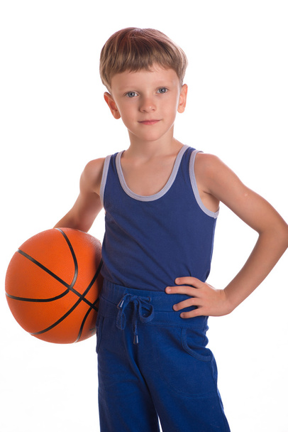 The boy held a basketball ball to a hi - Foto, Bild