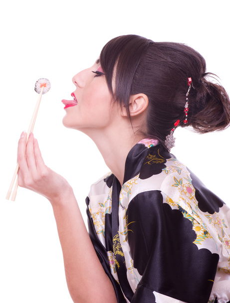 όμορφη κοπέλα με ιαπωνικό σούσι κυλίνδρους, - Φωτογραφία, εικόνα