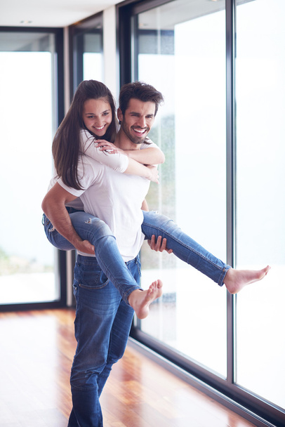 happy young romantic couple having fun relaxing at modern home living room interior - Fotografie, Obrázek
