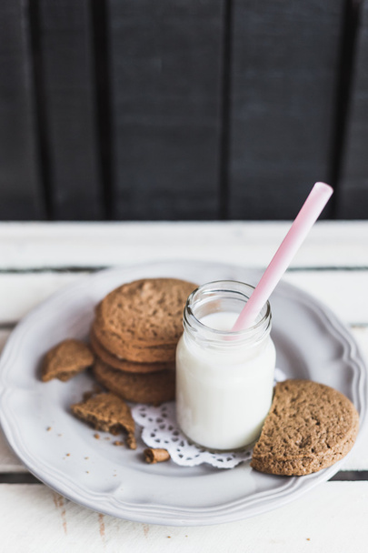 Rustic home made cookies on the wooden background with milk - Foto, imagen