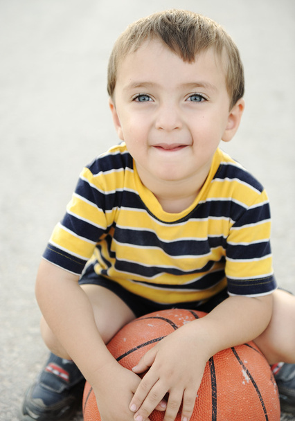 Adorable child holding the basketball - Foto, imagen