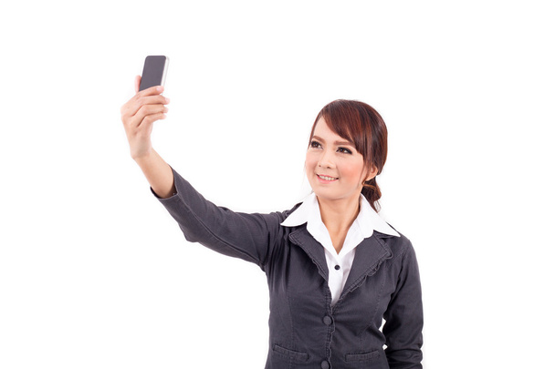 Young business woman holding cellphone on white background - Photo, image