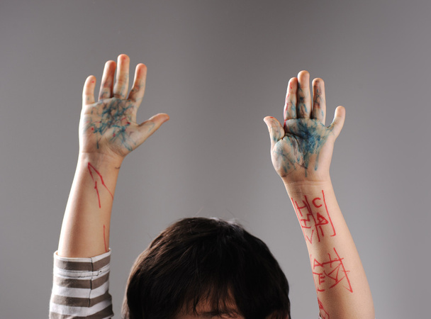 Messy hands, little guilty surrender with hands up - Photo, Image