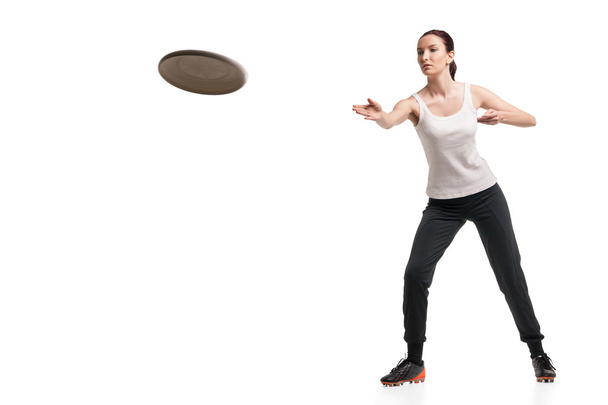 young happy woman playing frisbee over white - Valokuva, kuva
