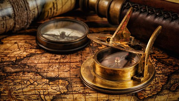 Old vintage compass on ancient map - Фото, изображение