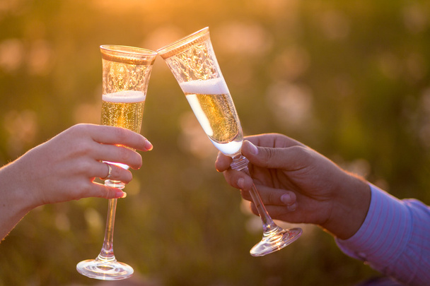 Glasses with champers at sunset - Photo, Image