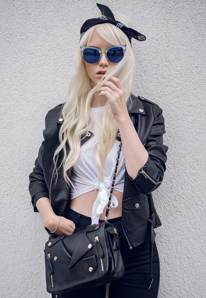 Stylish girl in cool sunglasses outdoors - Fotó, kép