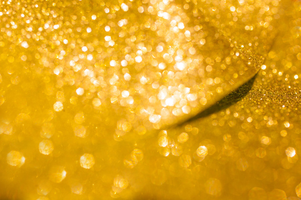 Golden glitter christmas abstract background. Shiny golden lights - Photo, Image