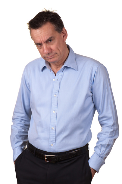 Сердитий жахливий чоловік з руками в кишенях
 - Фото, зображення
