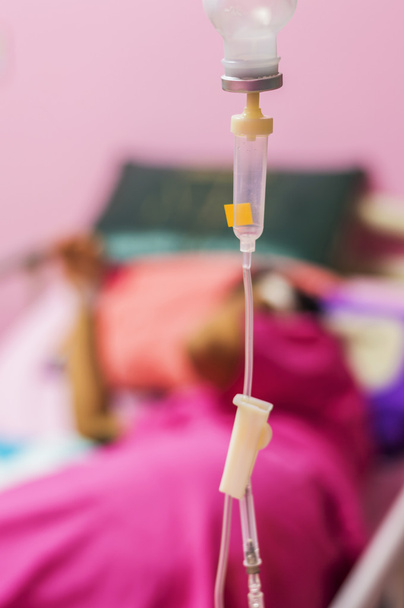 infusion bottle with patient in bed in hospital - Photo, Image