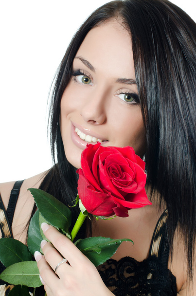 The girl with beautiful hair with a red rose - Photo, image