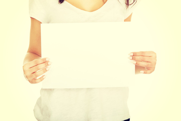 Young woman with blank paper. - Photo, Image