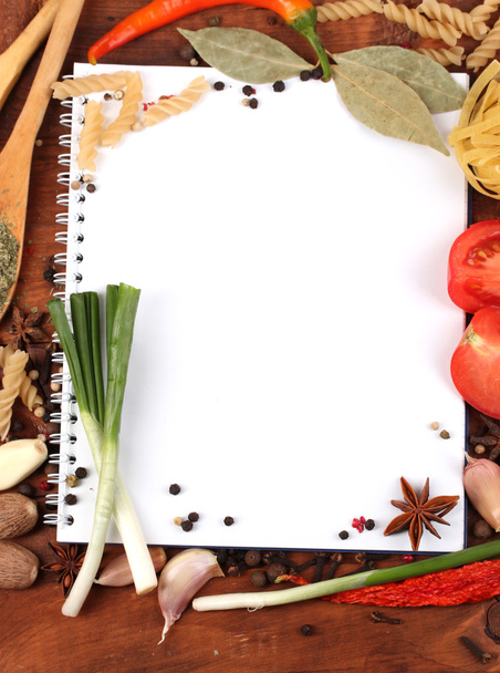 Notebook for recipes and spices on wooden table - Foto, Imagen