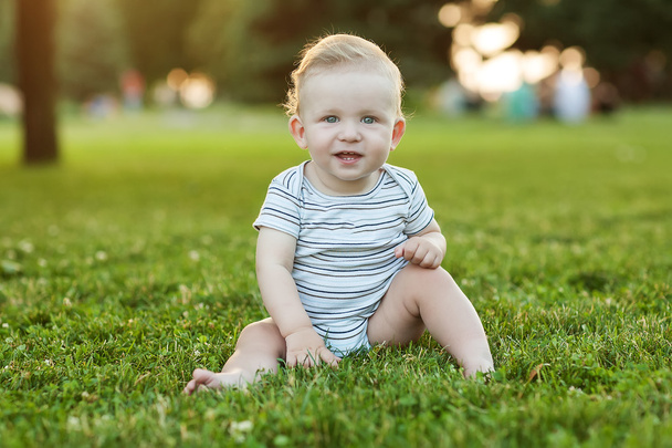 Caucasian baby boy take rest in summer park - Foto, immagini