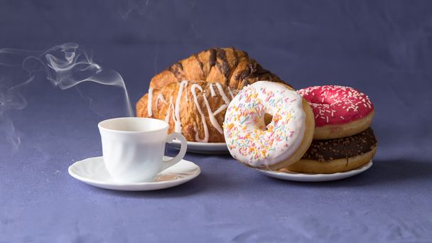 Cup of coffee with croissants and donuts - Valokuva, kuva