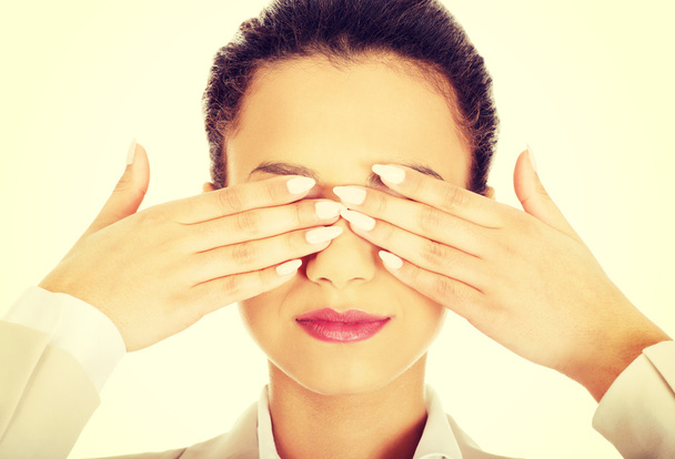 Businesswoman covering eyes with hands. - Valokuva, kuva