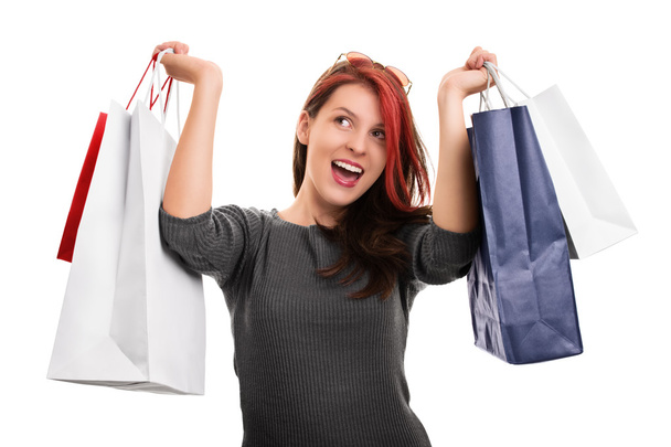 Young girl with shopping bags isolated on white background - Φωτογραφία, εικόνα