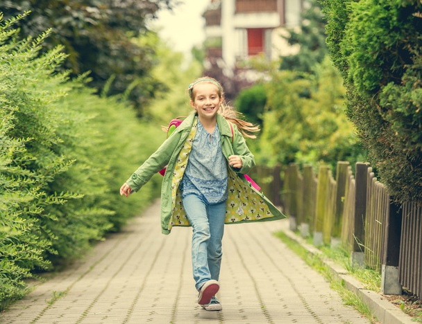 little girl go home from school - Фото, изображение