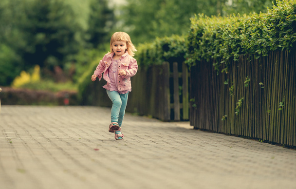 little cute girl running - Фото, изображение