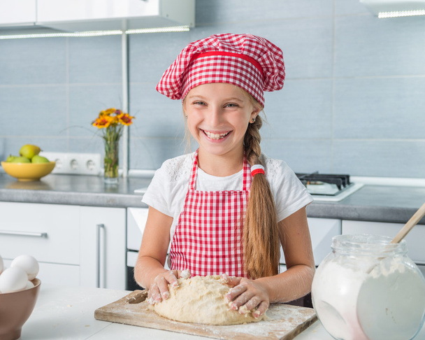 little girl kneading a dough - Zdjęcie, obraz