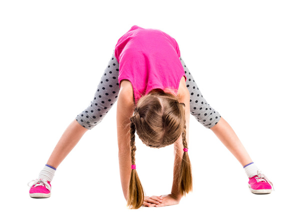 cute little girl stretching - Foto, afbeelding