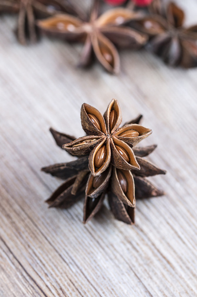 Star anise stacked over wooden background - Photo, Image